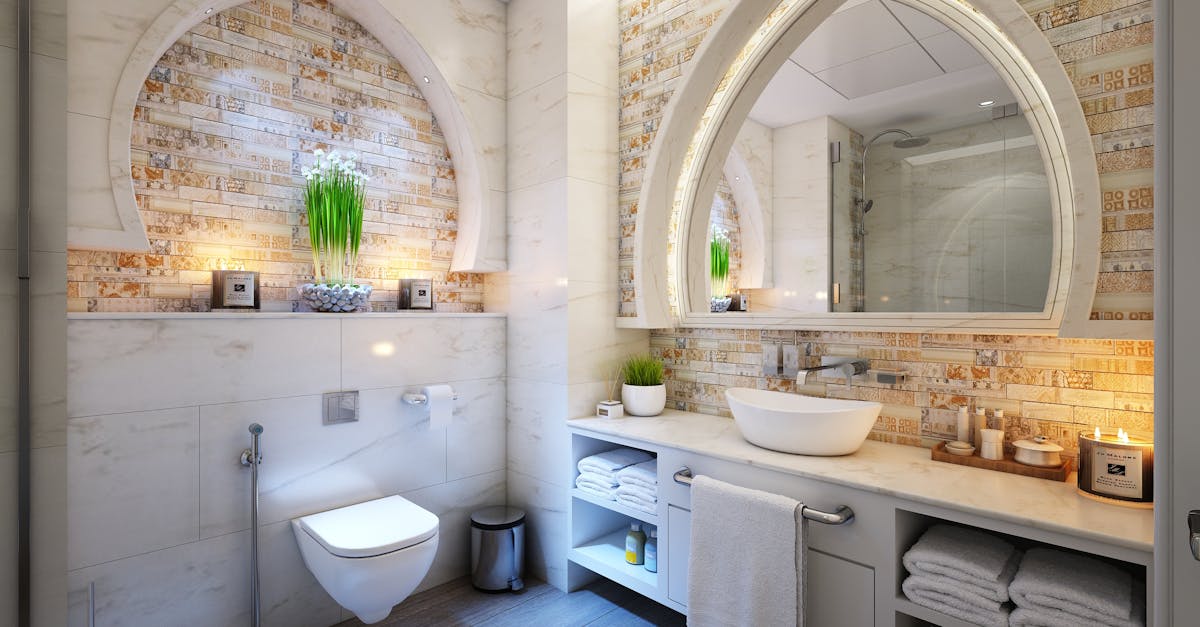 Elegant modern bathroom with marble tiles, ambient lighting, and stylish decor.